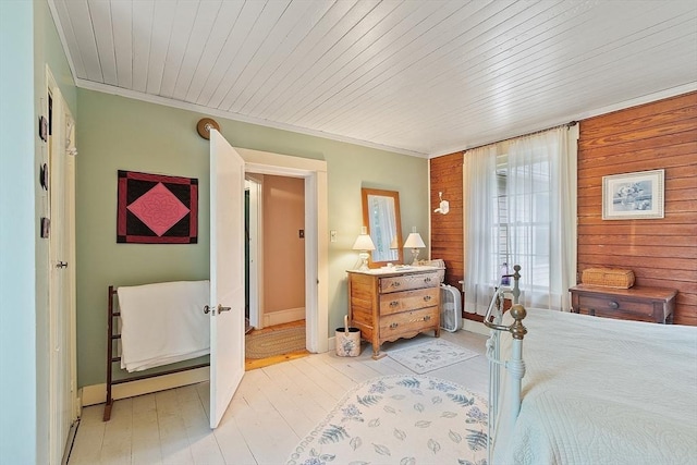 34 Fletcher Ln, Littleton, MA 01460 - bedroom featuring baseboards, light wood finished floors, wooden walls, crown molding, and wooden ceiling