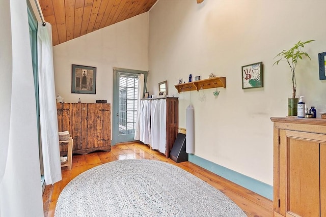 34 Fletcher Ln, Littleton, MA 01460 - entrance foyer featuring light wood-style floors, wood ceiling, baseboards, and high vaulted ceiling