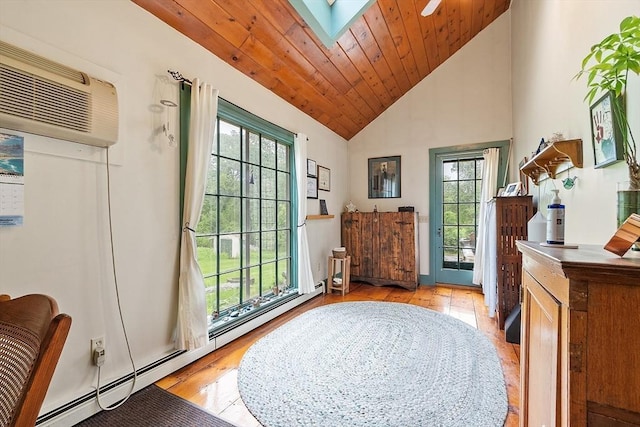 34 Fletcher Ln, Littleton, MA 01460 - entryway featuring plenty of natural light, baseboard heating, light wood-style flooring, a skylight, and high vaulted ceiling