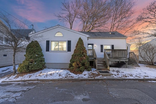 view of front of property with a wooden deck