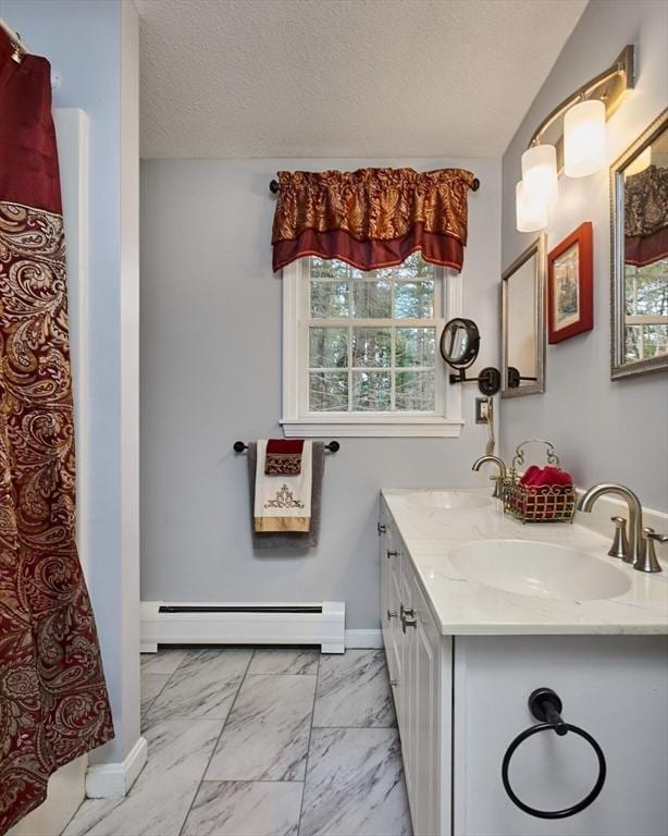 bathroom featuring a baseboard radiator, vanity, a textured ceiling, and a shower with shower curtain