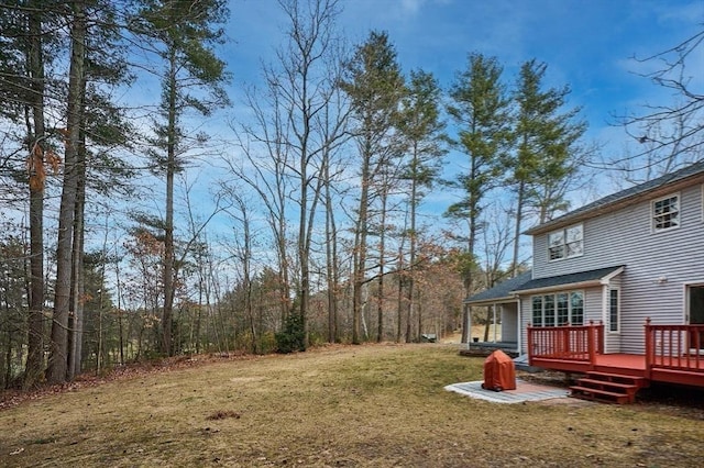 view of yard featuring a wooden deck