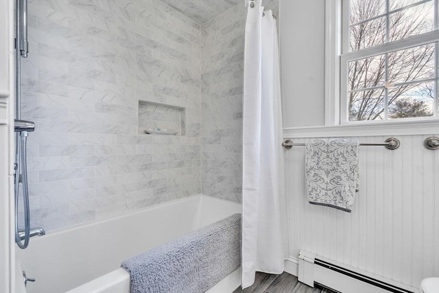 full bath featuring baseboard heating and shower / bath combination with curtain