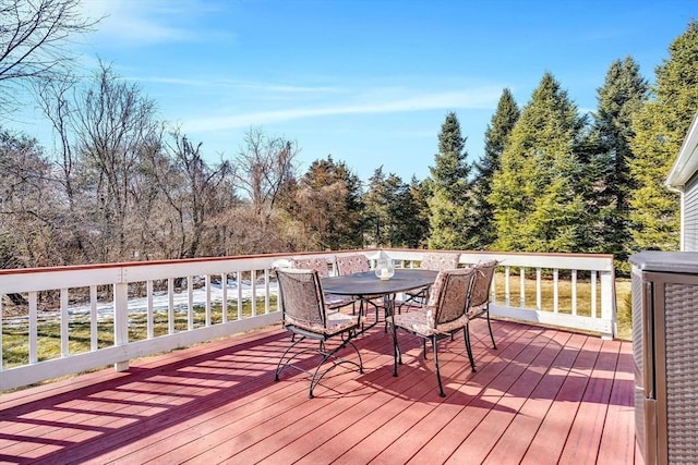 wooden terrace featuring outdoor dining area