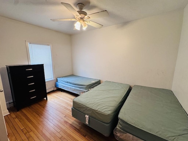 27 Shelby St, Worcester, MA 01605 - bedroom with hardwood / wood-style flooring, baseboard heating, and ceiling fan