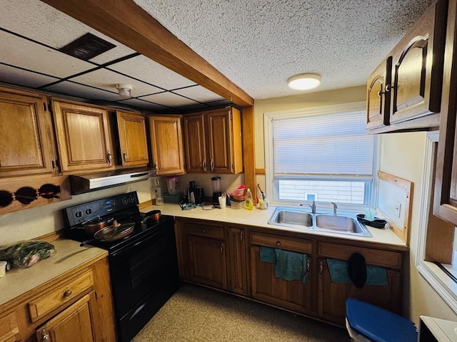27 Shelby St, Worcester, MA 01605 - kitchen with black range with electric cooktop, light countertops, extractor fan, brown cabinets, and a textured ceiling