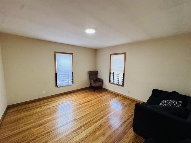 27 Shelby St, Worcester, MA 01605 - sitting room with light wood-type flooring and baseboards