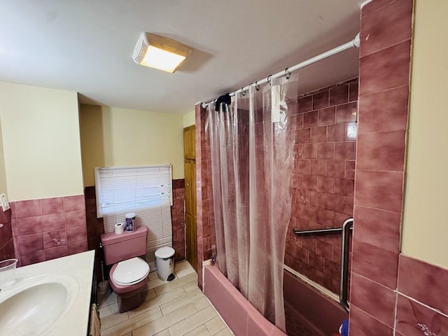 27 Shelby St, Worcester, MA 01605 - bathroom featuring tile walls, shower / bath combo with shower curtain, vanity, and a wainscoted wall