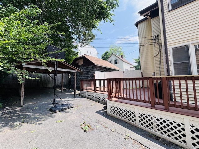 27 Shelby St, Worcester, MA 01605 - view of patio / terrace featuring a deck and a carport