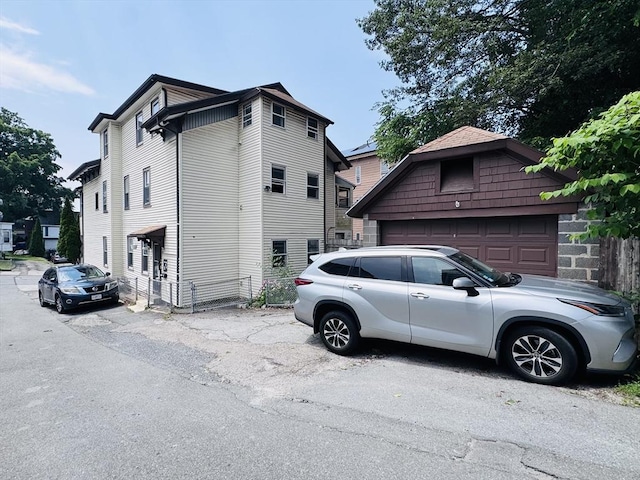 27 Shelby St, Worcester, MA 01605 - view of side of home featuring a garage