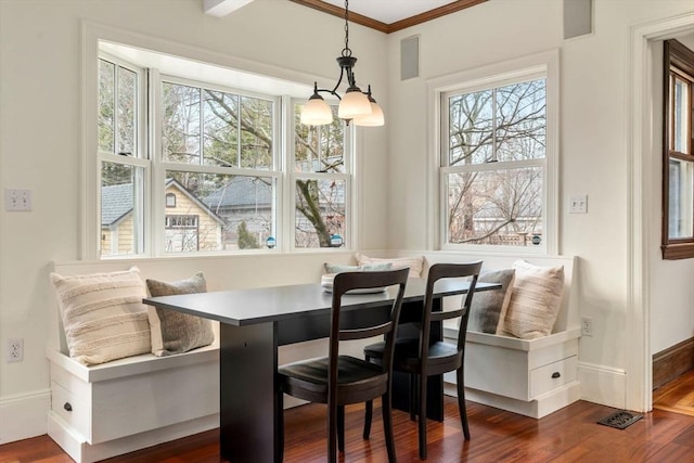 dining room with dark wood-type flooring, visible vents, baseboards, and breakfast area