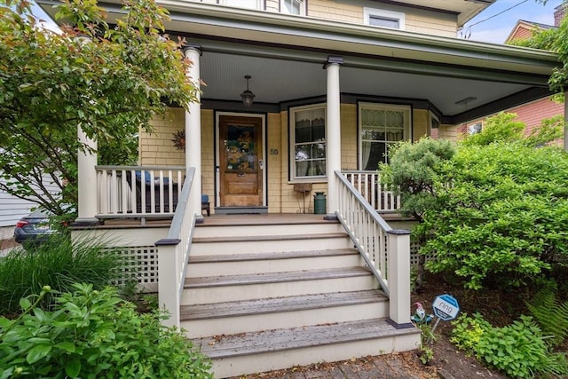 entrance to property featuring covered porch