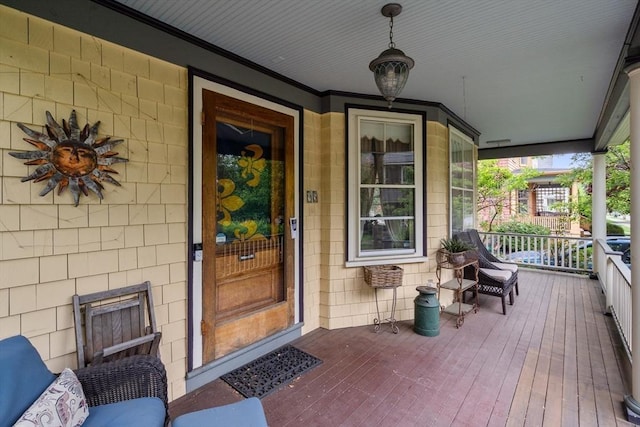 view of exterior entry featuring a porch