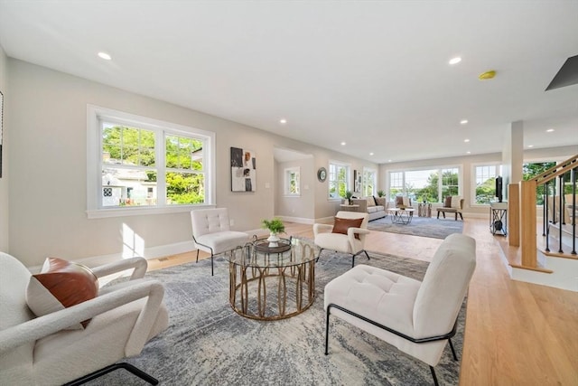 43 Lake Ave, Sharon, MA 02067 - living room with recessed lighting, stairs, and light wood finished floors