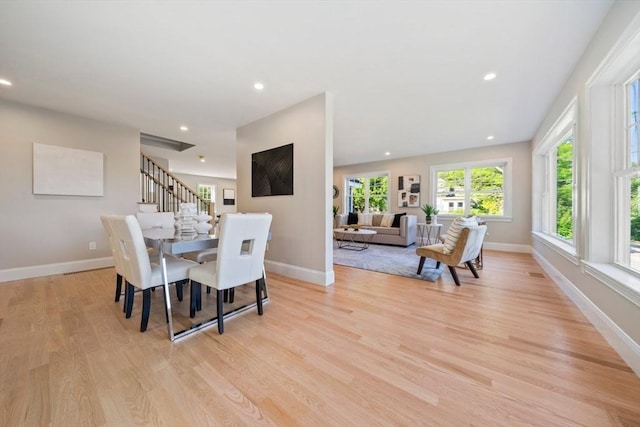 43 Lake Ave, Sharon, MA 02067 - dining space with plenty of natural light, light wood-type flooring, recessed lighting, and stairs