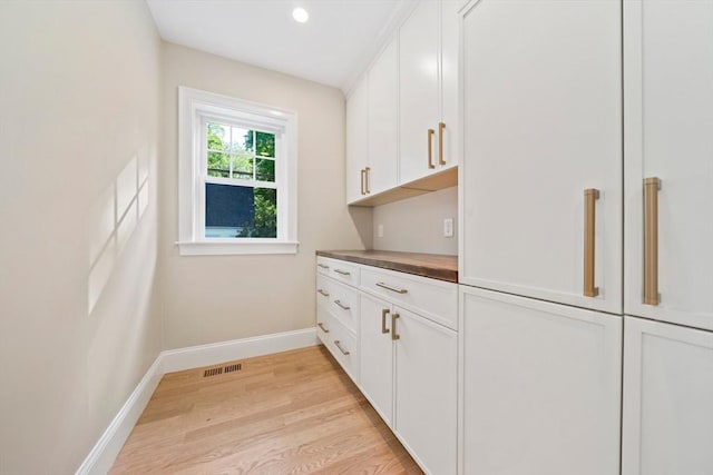 43 Lake Ave, Sharon, MA 02067 - kitchen featuring light wood-type flooring, white cabinetry, and recessed lighting