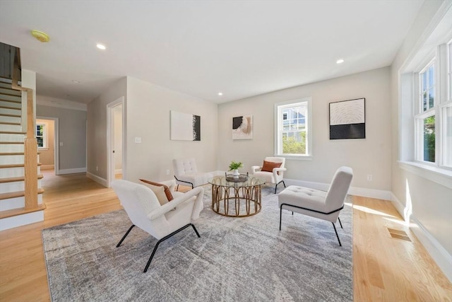 43 Lake Ave, Sharon, MA 02067 - living area featuring light wood finished floors, stairway, and recessed lighting