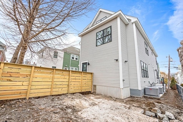 view of side of property with fence