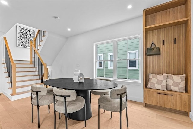 dining space with baseboards, stairway, light wood-style flooring, and recessed lighting