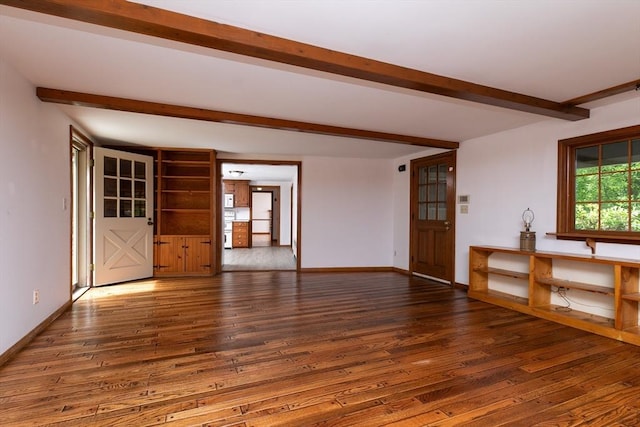 10 Whipple Rd, Hamilton, MA 01982 - unfurnished living room with beamed ceiling, wood finished floors, and baseboards