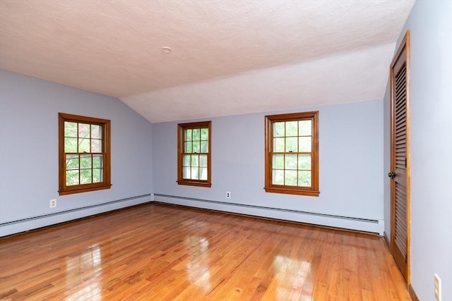 10 Whipple Rd, Hamilton, MA 01982 - unfurnished room featuring light wood-type flooring, vaulted ceiling, a baseboard radiator, and baseboards