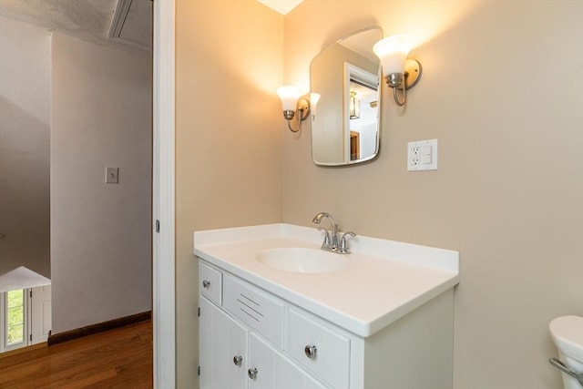 10 Whipple Rd, Hamilton, MA 01982 - half bath with vanity, wood finished floors, and toilet