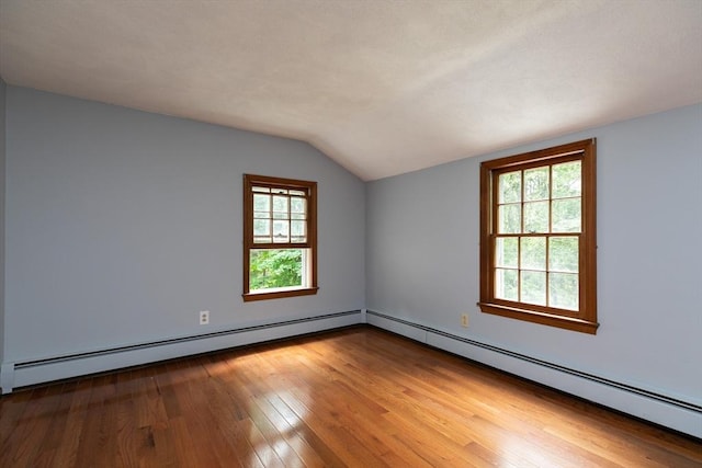 10 Whipple Rd, Hamilton, MA 01982 - spare room with baseboard heating, vaulted ceiling, and hardwood / wood-style floors