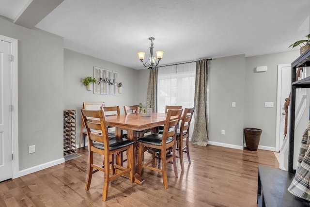 261 Bean Porridge Hill Rd, Westminster, MA 01473 - dining room with baseboards, wood finished floors, and an inviting chandelier