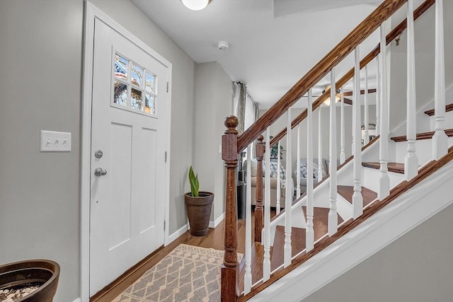 261 Bean Porridge Hill Rd, Westminster, MA 01473 - entryway with baseboards, wood finished floors, and stairway