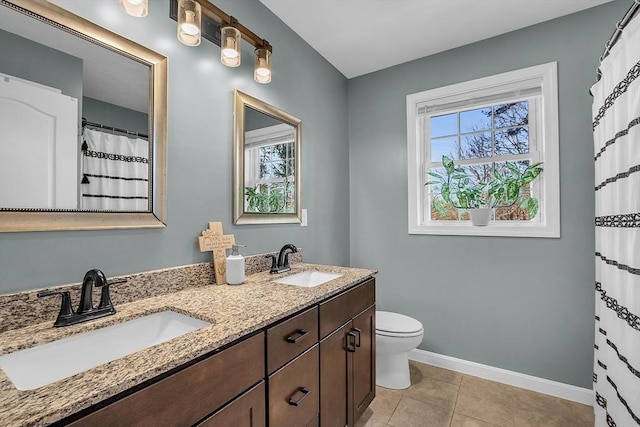 261 Bean Porridge Hill Rd, Westminster, MA 01473 - full bath with baseboards, toilet, tile patterned flooring, and a sink