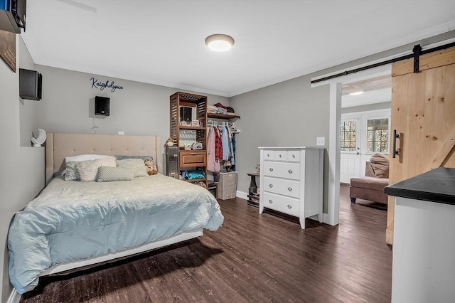 261 Bean Porridge Hill Rd, Westminster, MA 01473 - bedroom featuring crown molding, baseboards, a barn door, and wood finished floors