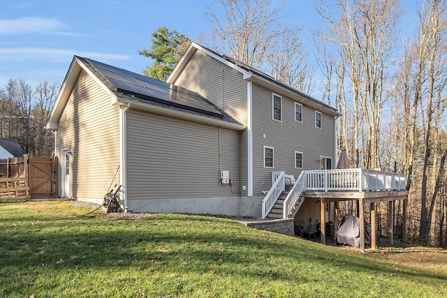 261 Bean Porridge Hill Rd, Westminster, MA 01473 - back of property with a yard, solar panels, stairway, and a wooden deck