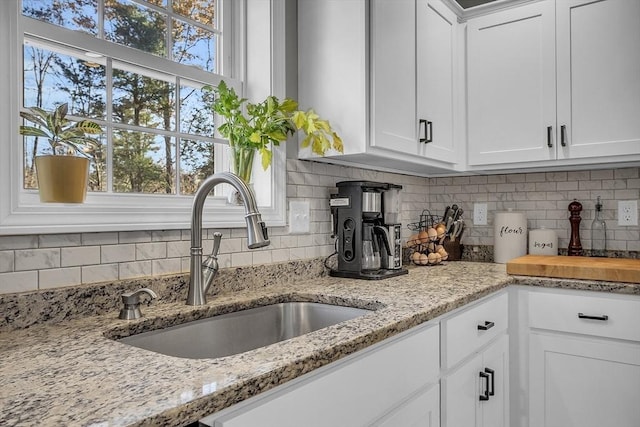 261 Bean Porridge Hill Rd, Westminster, MA 01473 - kitchen with white cabinetry, backsplash, and a sink
