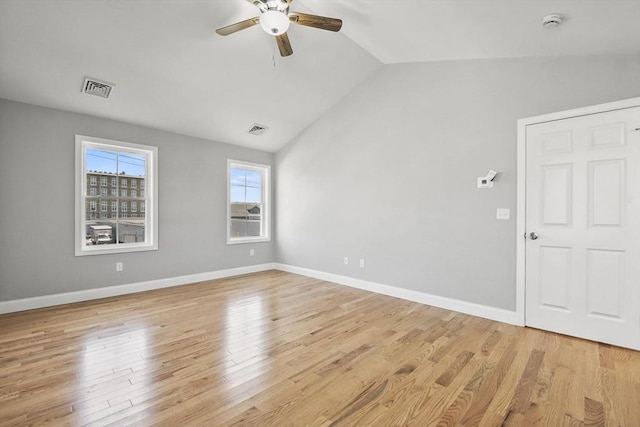 119 Tripp St, Fall River, MA 02724 - empty room featuring ceiling fan, lofted ceiling, a smoke detector, and light wood-style flooring
