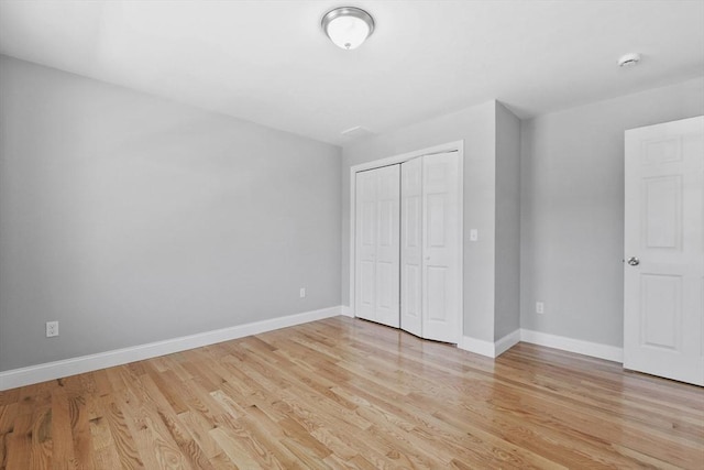 119 Tripp St, Fall River, MA 02724 - unfurnished bedroom featuring light wood finished floors and a closet