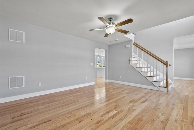 119 Tripp St, Fall River, MA 02724 - unfurnished living room with stairway, ceiling fan, and light wood finished floors