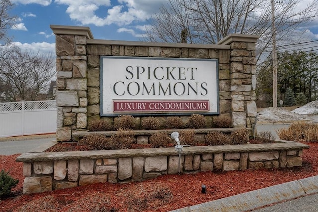 community sign featuring fence