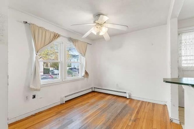 spare room featuring ceiling fan and wood finished floors