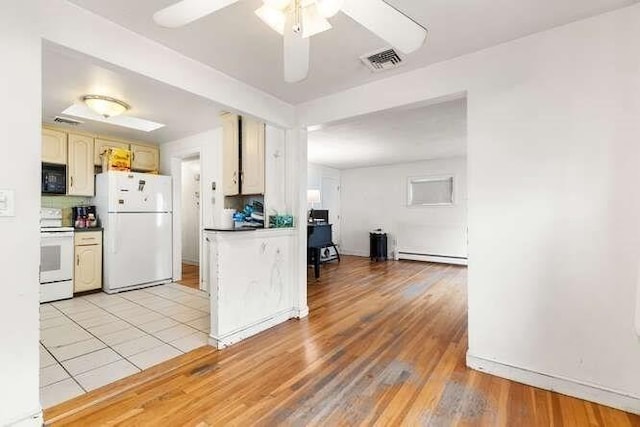 kitchen featuring visible vents, a ceiling fan, white appliances, a baseboard radiator, and light wood-style flooring