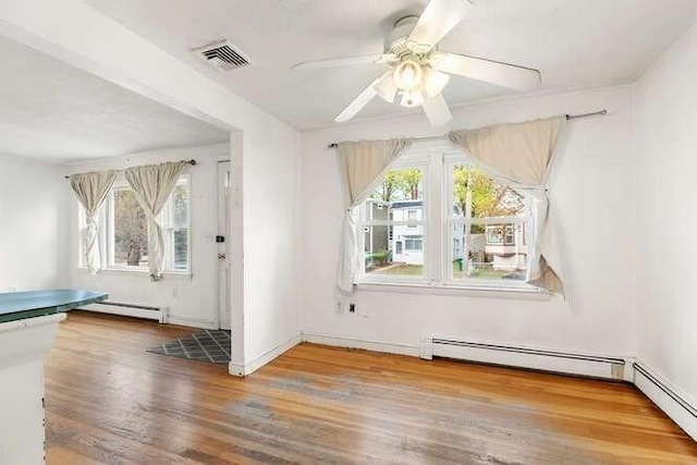 bonus room featuring ceiling fan, visible vents, plenty of natural light, and wood finished floors