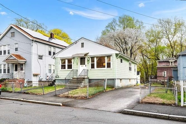 view of front of home with a gate and a fenced front yard