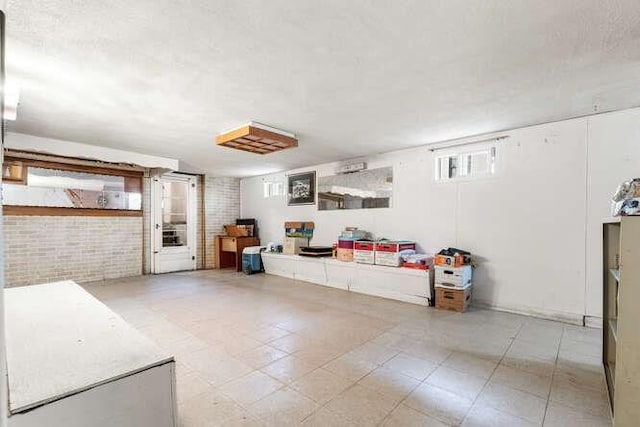 living room with brick wall