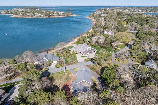 aerial view of property and surrounding area featuring a nearby body of water