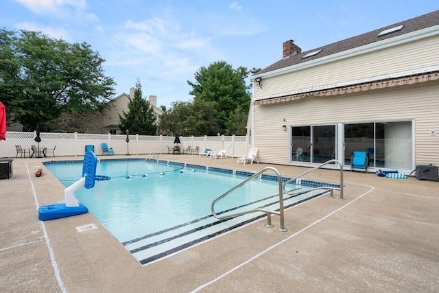 view of pool featuring a patio area