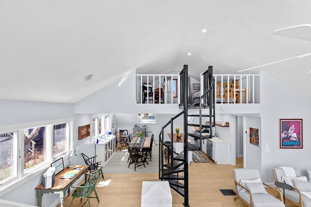 2111/2 Bradford St, Provincetown, MA 02657 - living area featuring wood finished floors, stairs, and high vaulted ceiling