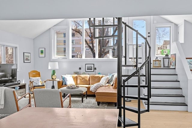2111/2 Bradford St, Provincetown, MA 02657 - living room featuring wood finished floors, stairs, and vaulted ceiling
