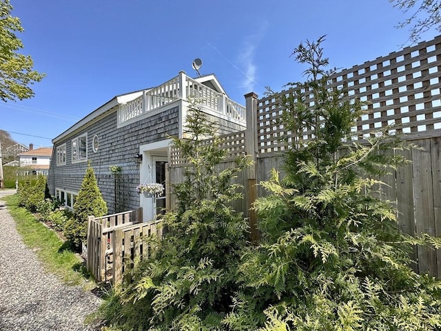 2111/2 Bradford St, Provincetown, MA 02657 - view of home's exterior with a balcony and fence