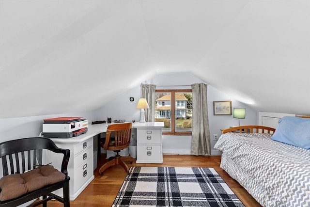 2111/2 Bradford St, Provincetown, MA 02657 - bedroom with lofted ceiling, wood finished floors, and a desk