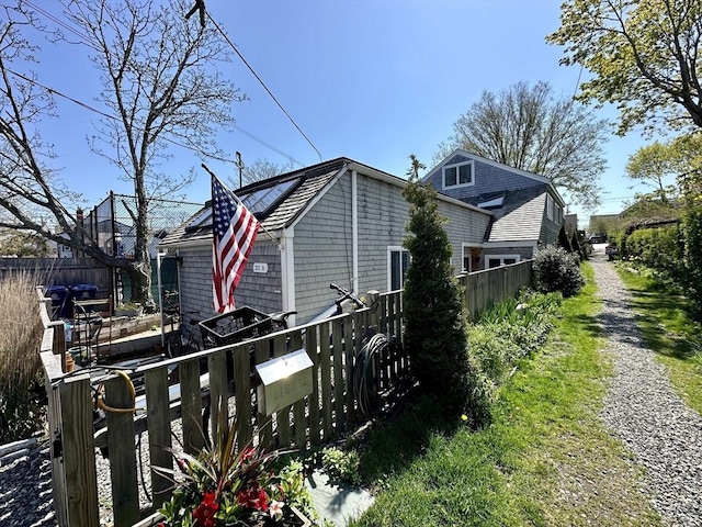 2111/2 Bradford St, Provincetown, MA 02657 - view of side of home featuring driveway and fence