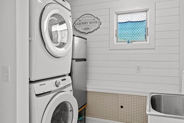 2111/2 Bradford St, Provincetown, MA 02657 - laundry area with estacked washer and dryer and wooden walls